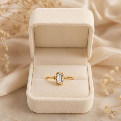 Juno Clear Stone Ring in gold finish presented in a cream jewellery gift box